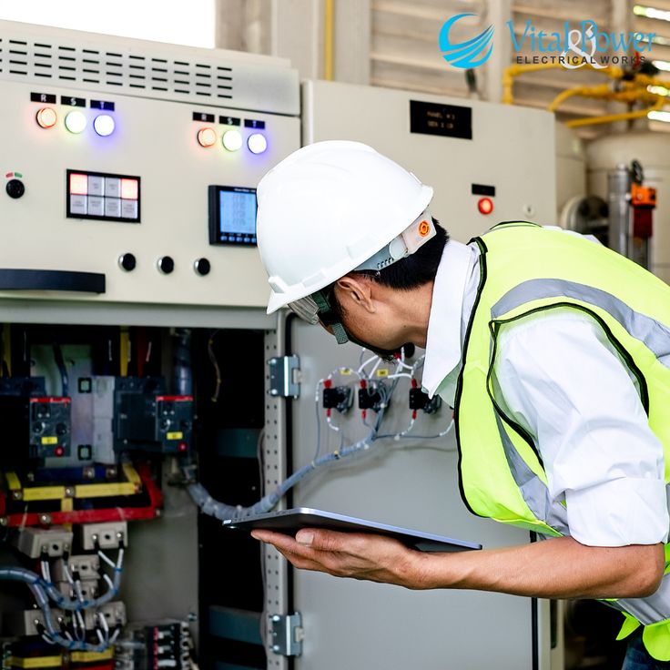 Electrician working on electrical panel