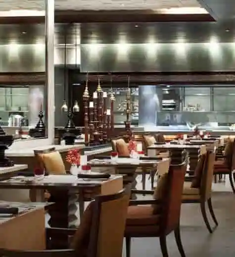 Interior of a modern restaurant with neatly arranged tables and chairs